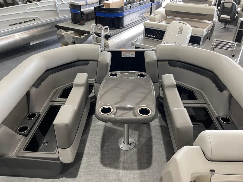 Slide: The Image of 2025 Princecraft Vectra 21 RL pontoon boat interior with seating and table. - 17