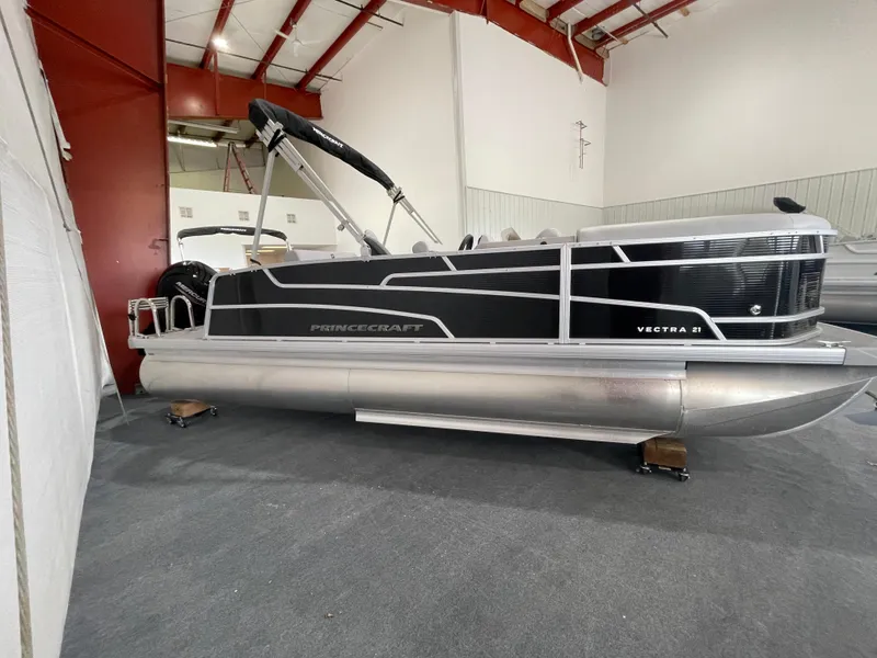 Slide: The Image of 2025 Princecraft Vectra 21 RL pontoon boat in indoor storage. - 3