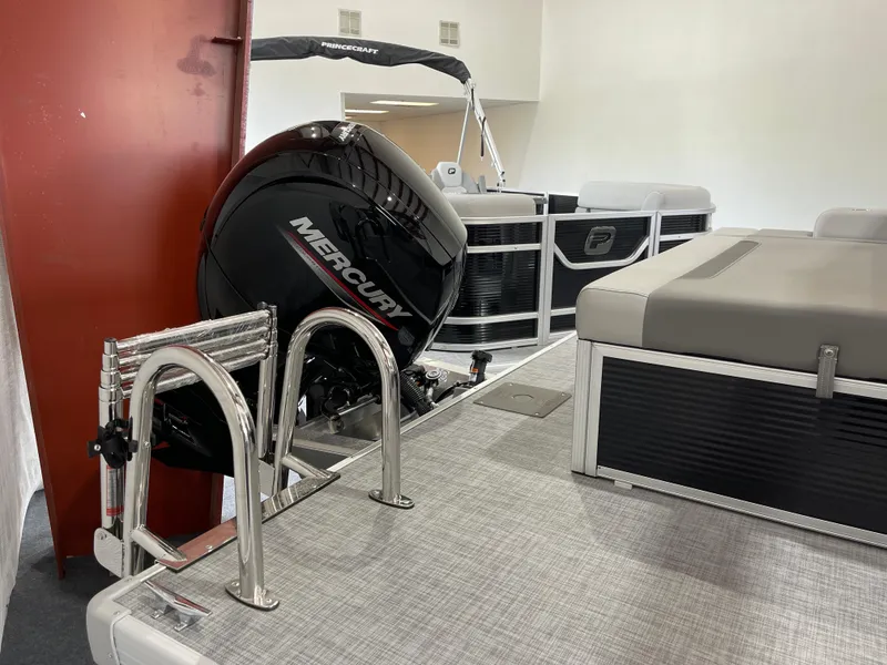 Slide: The Image of 2025 Princecraft Vectra 21 RL pontoon boat with Mercury engine and seating area. - 5