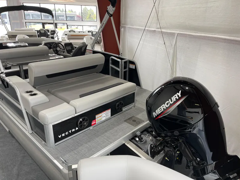 Slide: The Image of 2025 Princecraft Vectra 21 RL pontoon boat with Mercury outboard motor in showroom. - 6