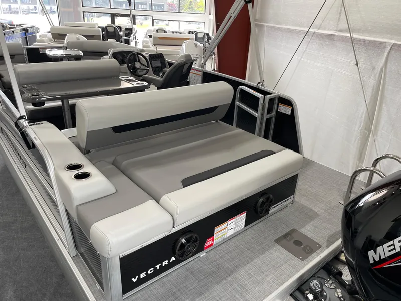 Slide: The Image of 2025 Princecraft Vectra 21 RL pontoon boat interior with gray seating and Mercury engine. - 7