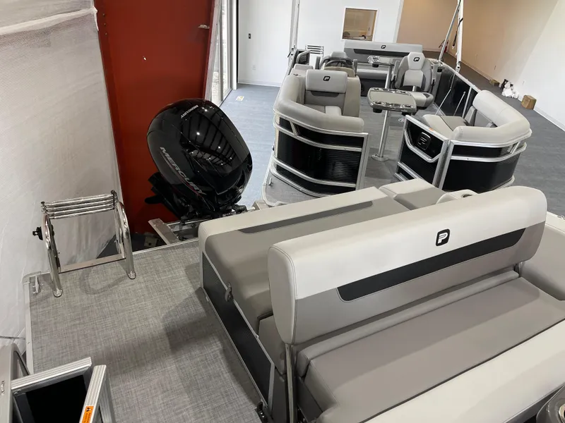 Slide: The Image of 2025 Princecraft Vectra 21 RL pontoon boat interior with seating and motor. - 9
