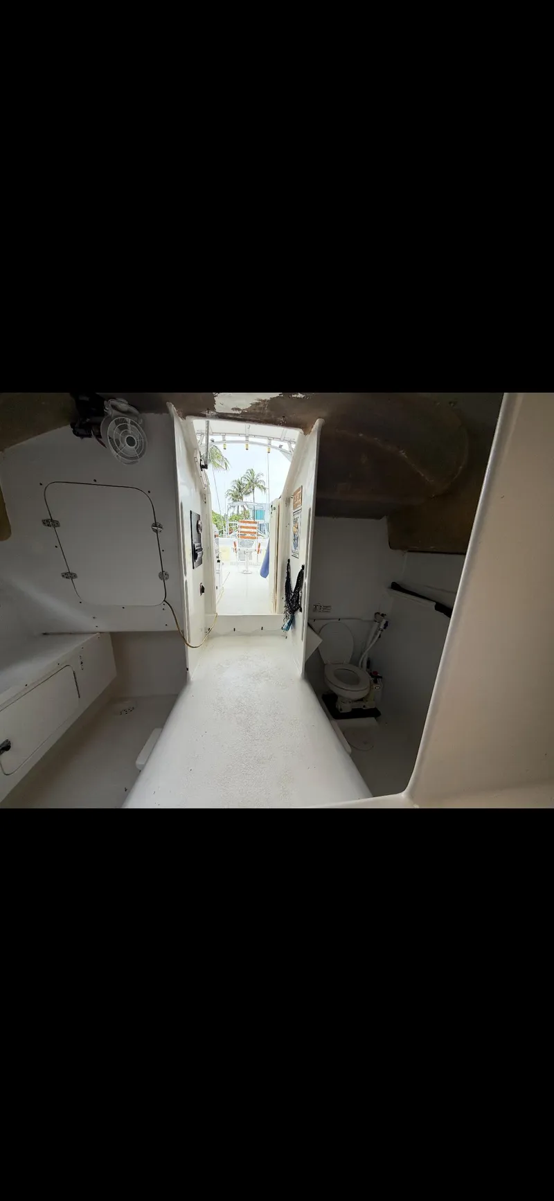 Slide: The Image of Interior view of a 2000 Powercat Catamaran, showcasing spacious cabin layout. - 13