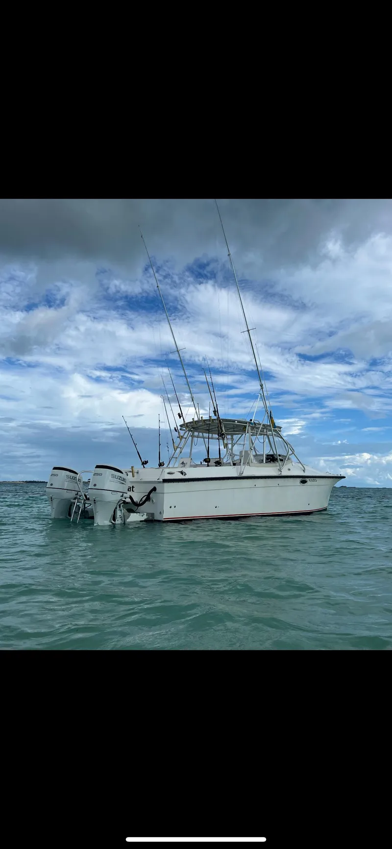 Slide: The Image of 2000 Powercat Catamaran on calm sea under cloudy sky. - 3