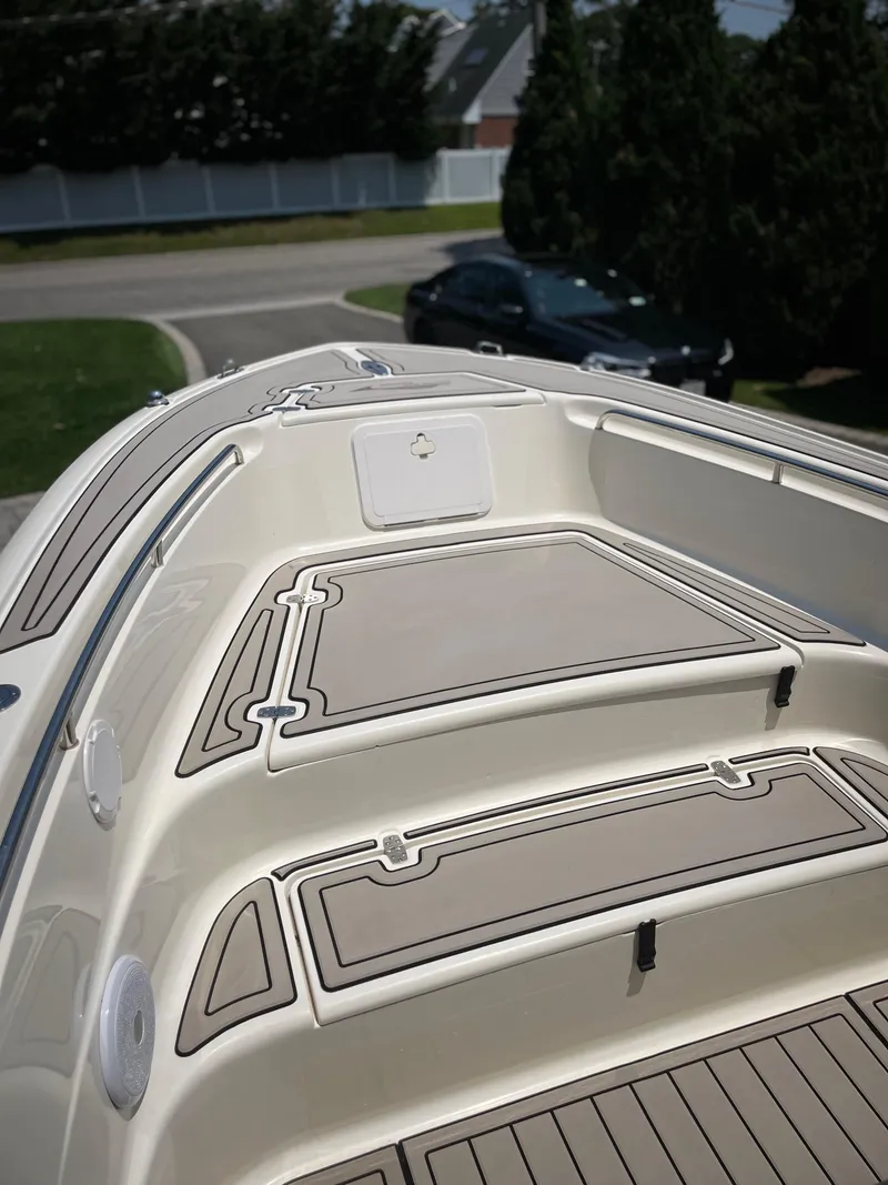 Slide: The Image of 2023 Scout 235 Sportfish boat deck with sleek design and modern features. - 14