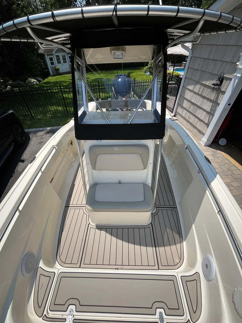 Slide: The Image of 2023 Scout 235 Sportfish boat with T-top and spacious deck. - 15