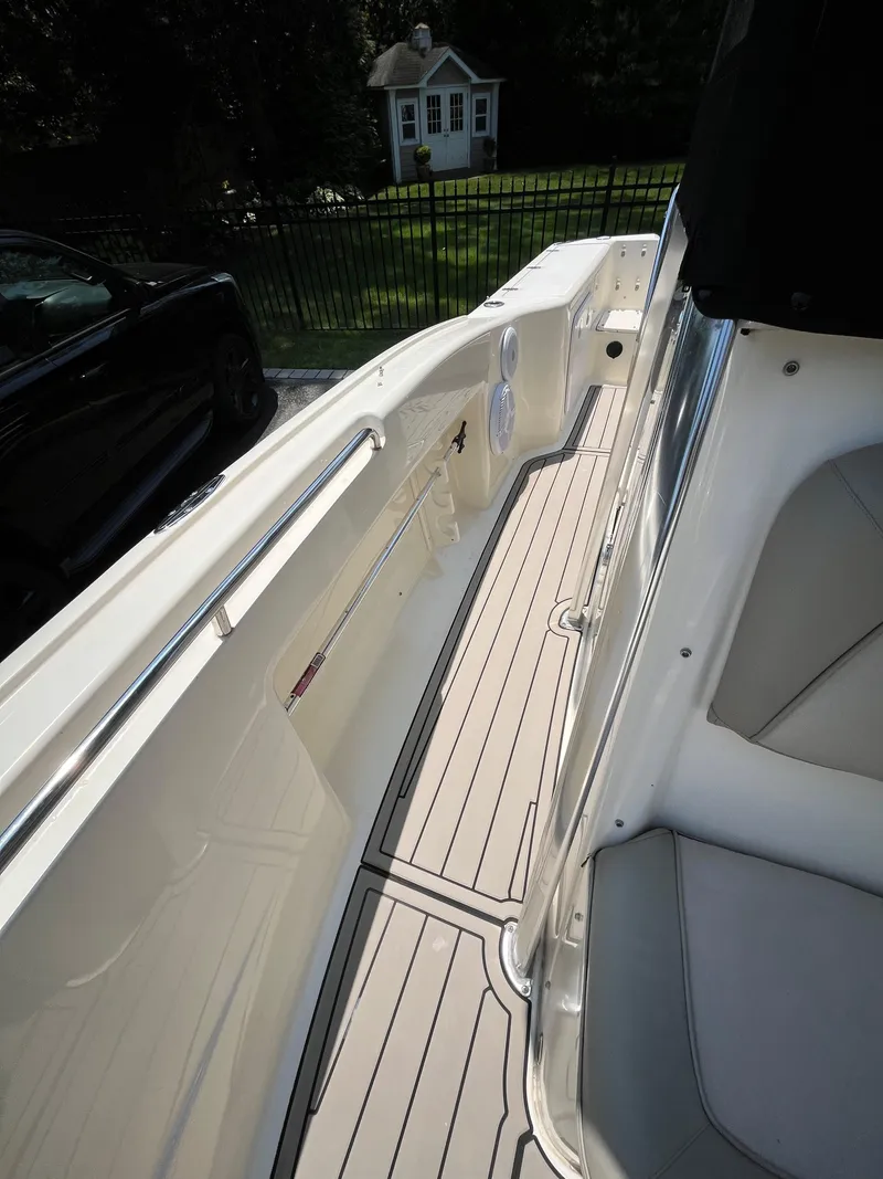 Slide: The Image of 2023 Scout 235 Sportfish boat interior with sleek design and spacious seating. - 16