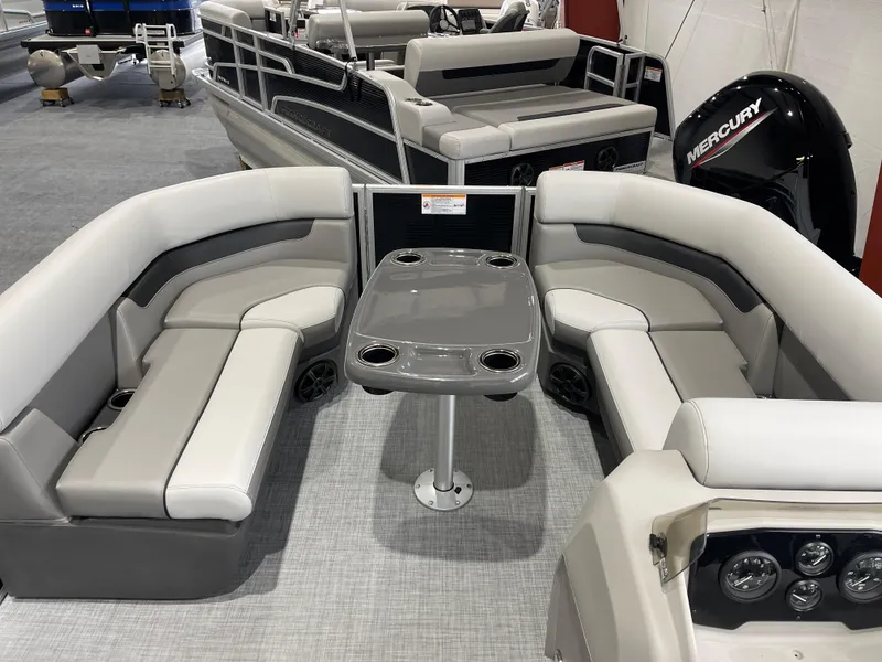 Slide: The Image of 2025 Princecraft Vectra 21 RL pontoon boat interior with seating and table. - 12