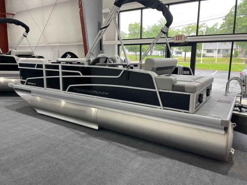 Slide: The Image of 2025 Princecraft Vectra 21 RL pontoon boat displayed indoors. - 3