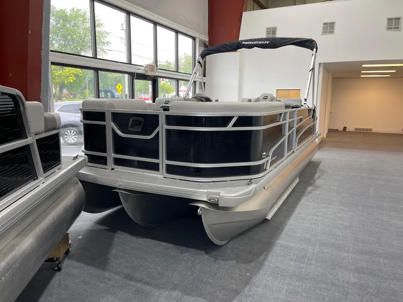 Slide: The Image of 2025 Princecraft Vectra 21 RL pontoon boat displayed indoors. - 4