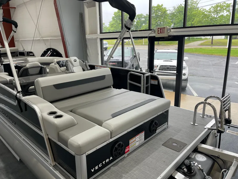 Slide: The Image of 2025 Princecraft Vectra 21 RL pontoon boat interior with seating and speakers. - 6