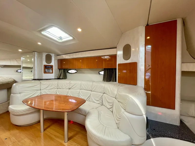 Slide: The Image of 2003 Formula 40 PC yacht interior with leather seating and wooden table. - 12