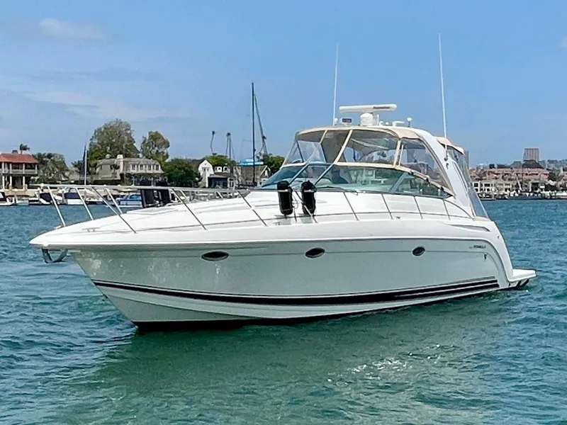 Slide: The Image of 2003 Formula 40 PC yacht cruising on a sunny day in a marina. - 2