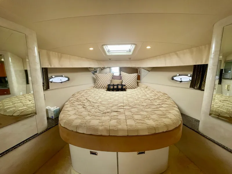 Slide: The Image of Luxurious cabin interior of 2003 Formula 40 PC yacht with cozy bed and porthole windows. - 26