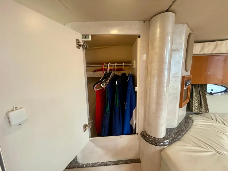 Slide: The Image of Cabin closet in 2003 Formula 40 PC yacht with hanging clothes. - 30