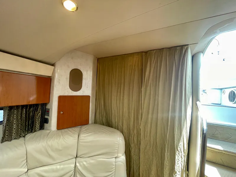 Slide: The Image of Interior of 2003 Formula 40 PC yacht with beige leather seating and curtain. - 33