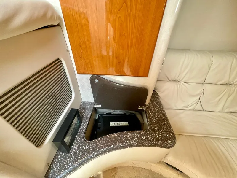 Slide: The Image of 2003 Formula 40 PC yacht interior with storage compartment and cushioned seating. - 34