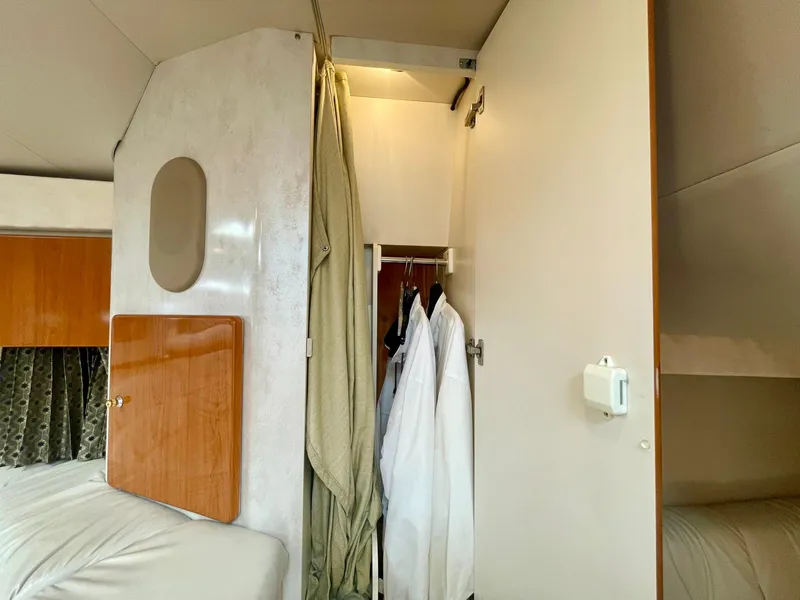 Slide: The Image of Interior of 2003 Formula 40 PC yacht showing closet with hanging clothes. - 35