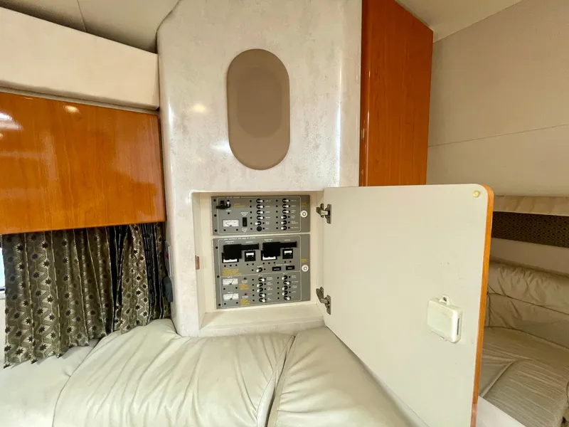 Slide: The Image of Electrical panel inside a 2003 Formula 40 PC boat cabin with wood accents. - 36