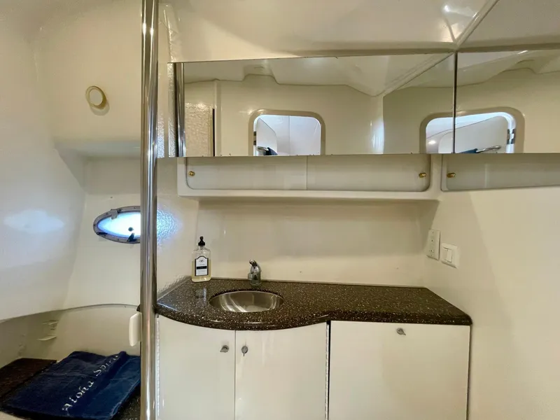 Slide: The Image of 2003 Formula 40 PC yacht bathroom with sink, mirror, and storage cabinets. - 40