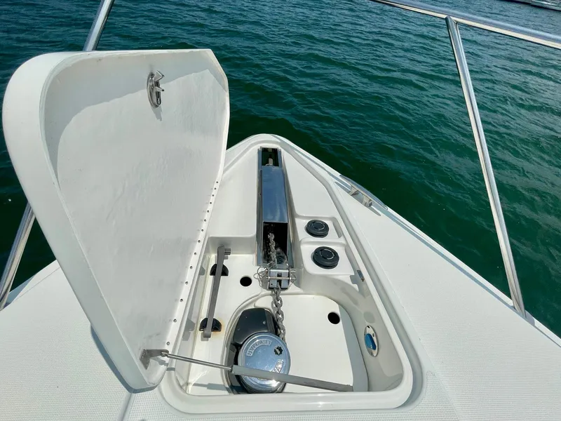 Slide: The Image of Anchor compartment of 2003 Formula 40 PC boat on water. - 43