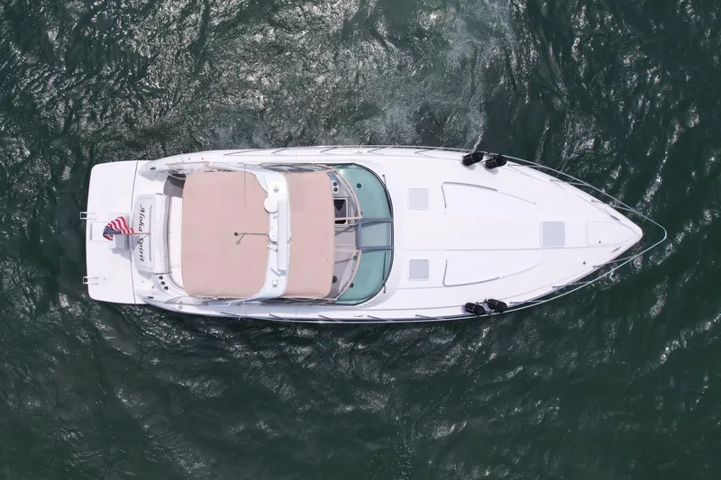 Slide: The Image of Aerial view of 2003 Formula 40 PC yacht cruising on open water. - 7