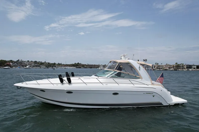Slide: The Image of 2003 Formula 40 PC yacht cruising on a sunny day with clear skies. - 8