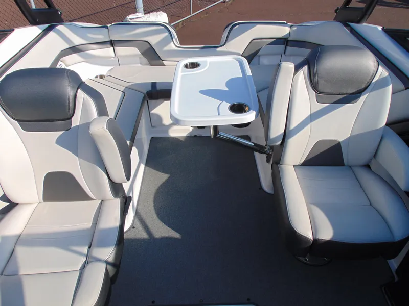 Slide: The Image of 2020 Yamaha Boats AR240 interior with seating and table, featuring modern design and comfort. - 10