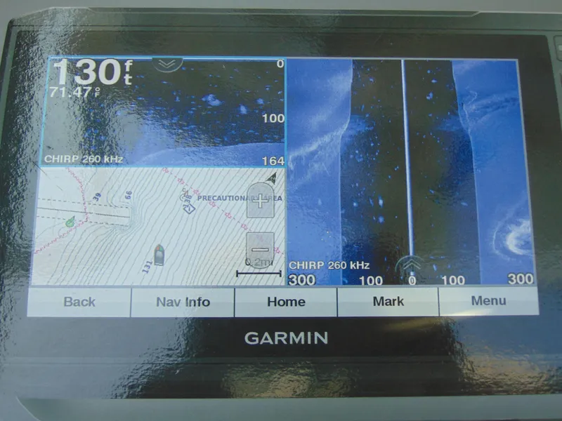 Slide: The Image of Garmin marine display showing sonar and navigation data on a Yamaha AR240 boat. - 12