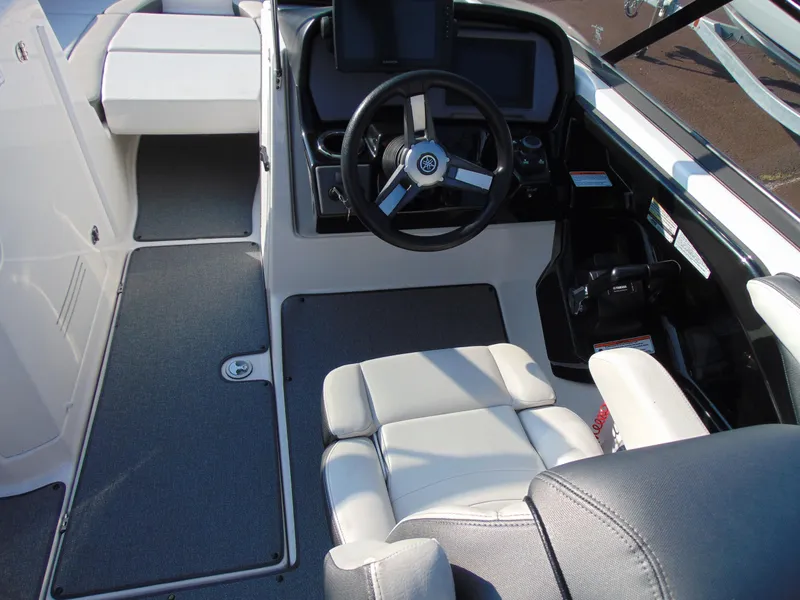 Slide: The Image of 2020 Yamaha Boats AR240 cockpit with steering wheel and seating. - 7