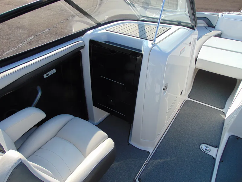 Slide: The Image of 2020 Yamaha Boats AR240 interior with seating and storage compartments. - 8