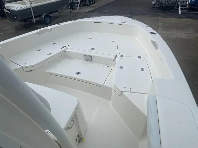 Slide: The Image of 2025 Pathfinder 2400 TRS boat interior with spacious seating and storage compartments. - 11