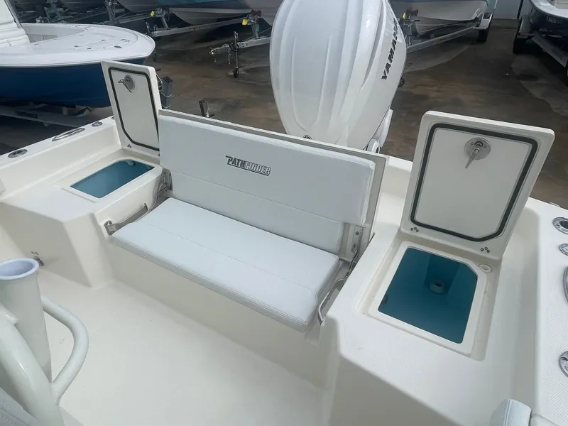 Slide: The Image of 2025 Pathfinder 2400 TRS boat interior with seating and storage compartments. - 15