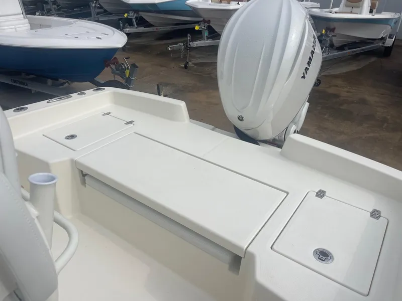 Slide: The Image of 2025 Pathfinder 2400 TRS boat with Yamaha outboard engine, rear deck view. - 16
