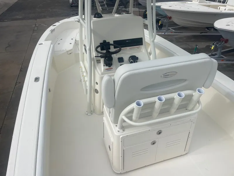 Slide: The Image of 2025 Pathfinder 2400 TRS boat interior with helm, seating, and rod holders. - 17