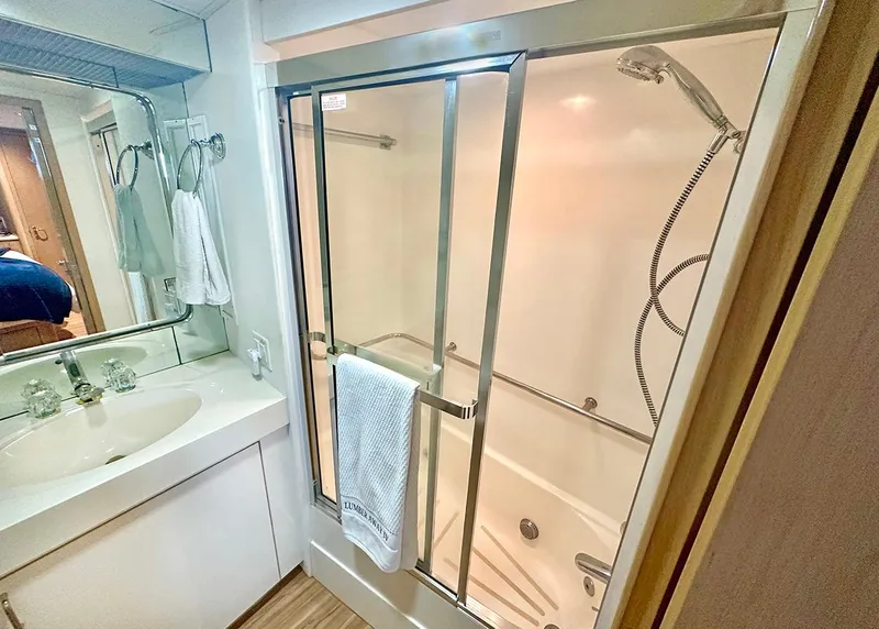 Slide: The Image of Bathroom interior of 1994 Hatteras Cockpit Motoryacht with shower and sink. - 25