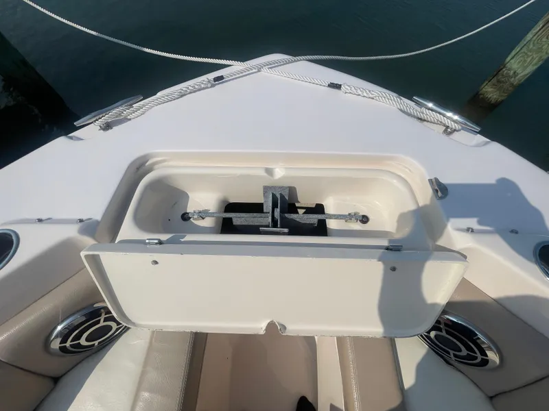 Slide: The Image of 2014 Grady-White Freedom 255 boat anchor compartment, open, showing anchor storage. - 13