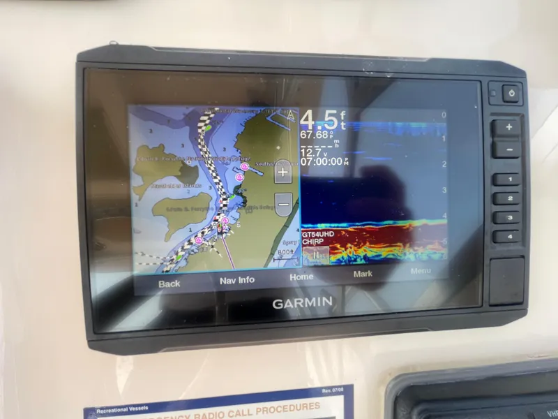 Slide: The Image of Garmin GPS display on 2014 Grady-White Freedom 255 boat, showing navigation and sonar data. - 21