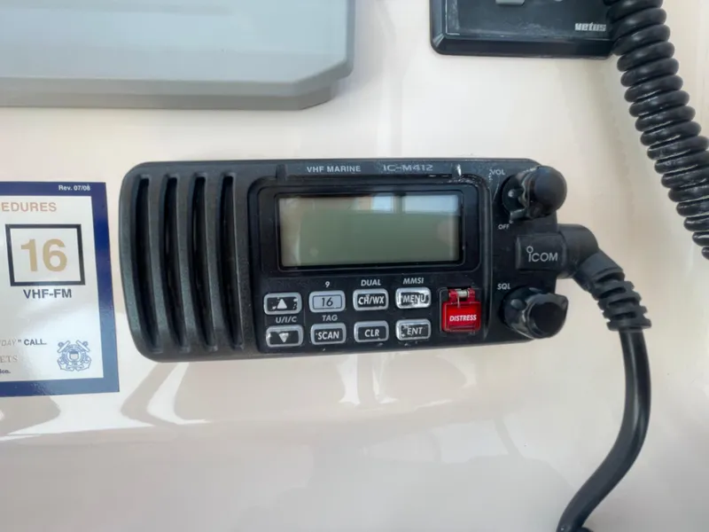 Slide: The Image of VHF marine radio on 2014 Grady-White Freedom 255 boat dashboard. - 22