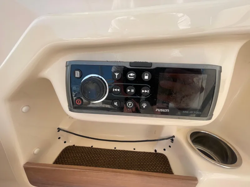 Slide: The Image of Fusion marine stereo system on 2014 Grady-White Freedom 255 boat dashboard. - 28