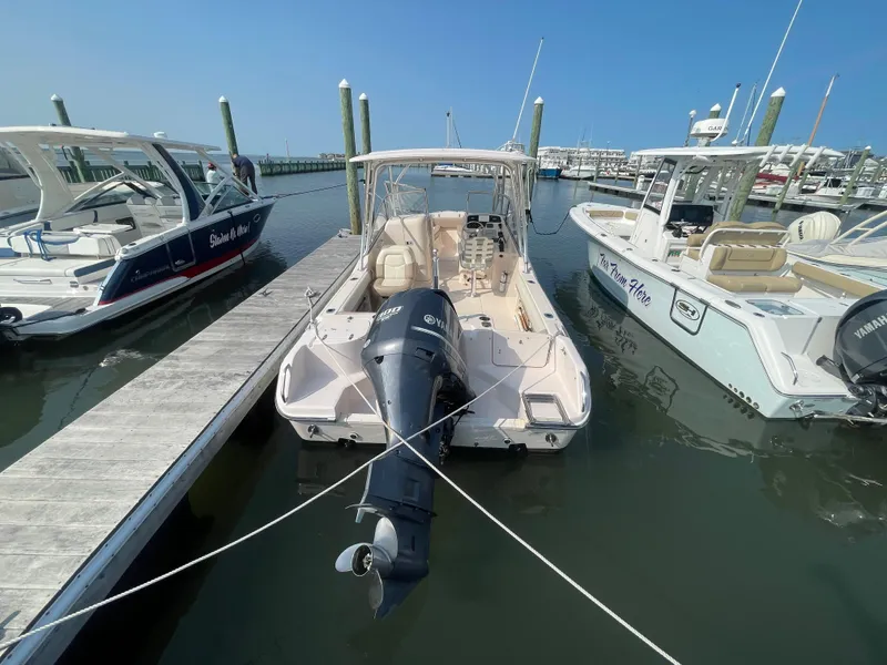 Slide: The Image of 2014 Grady-White Freedom 255 boat docked at marina, rear view. - 3