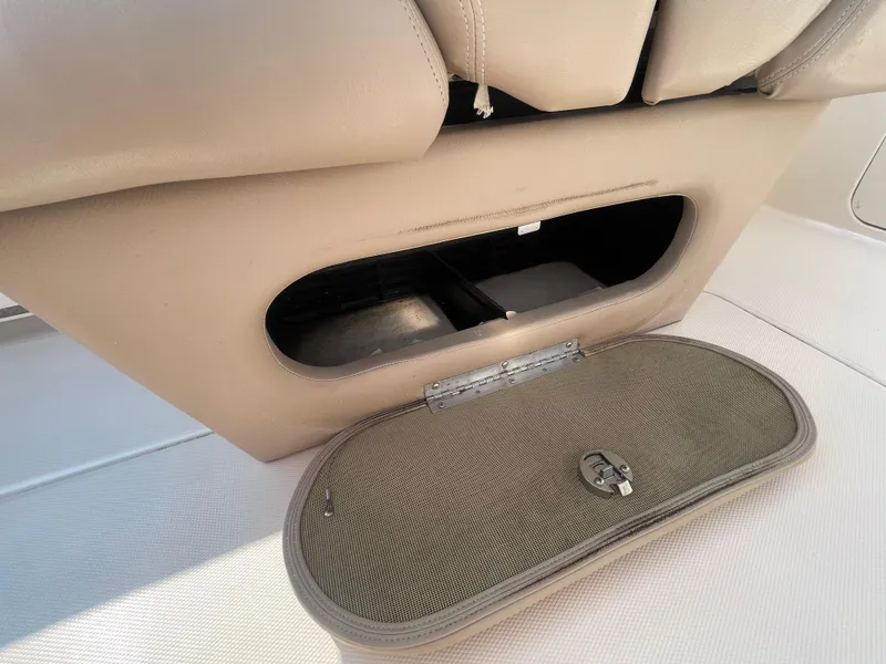 Slide: The Image of 2014 Grady-White Freedom 255 boat storage compartment with open hatch. - 32
