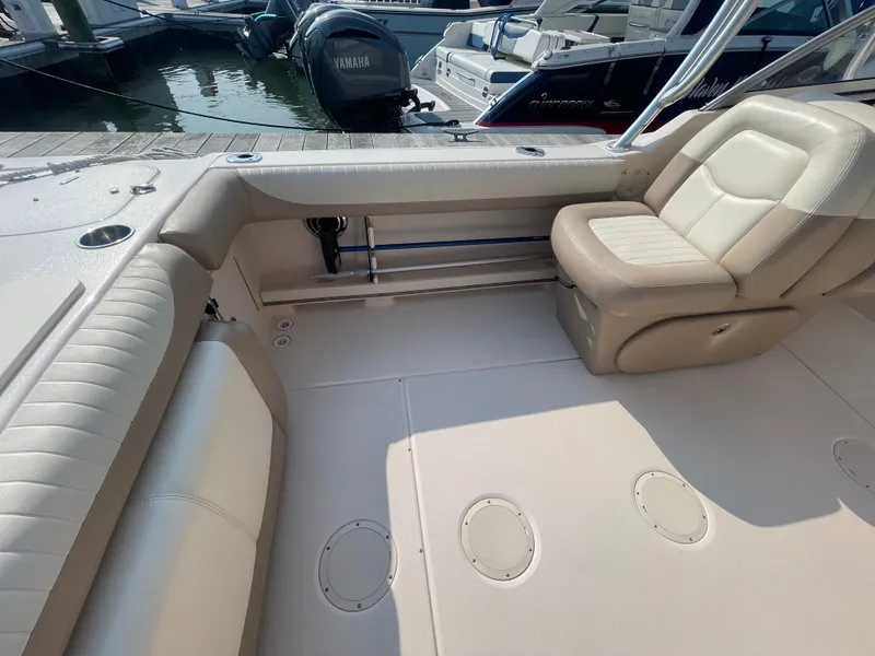 Slide: The Image of 2014 Grady-White Freedom 255 boat interior with beige seating and deck. - 33