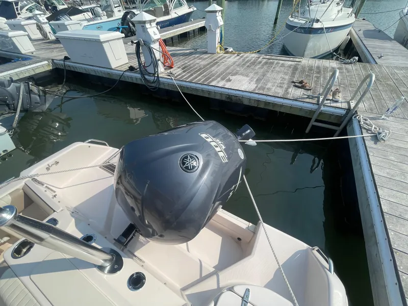 Slide: The Image of 2014 Grady-White Freedom 255 boat docked with Yamaha outboard engine. - 46