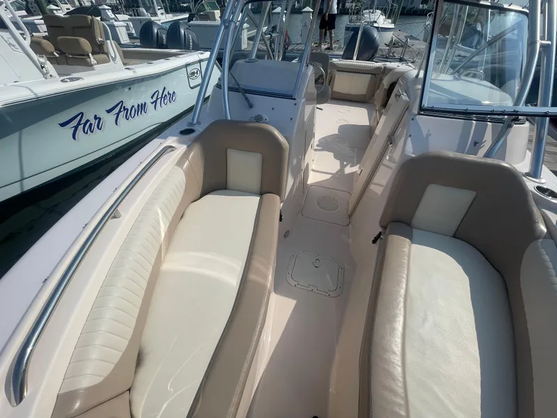 Slide: The Image of 2014 Grady-White Freedom 255 boat interior with beige seating and open deck. - 9