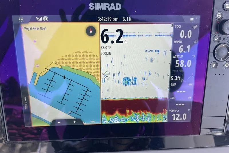Slide: The Image of Simrad marine display on 2023 Robalo R270 Center Console showing depth and navigation data. - 17