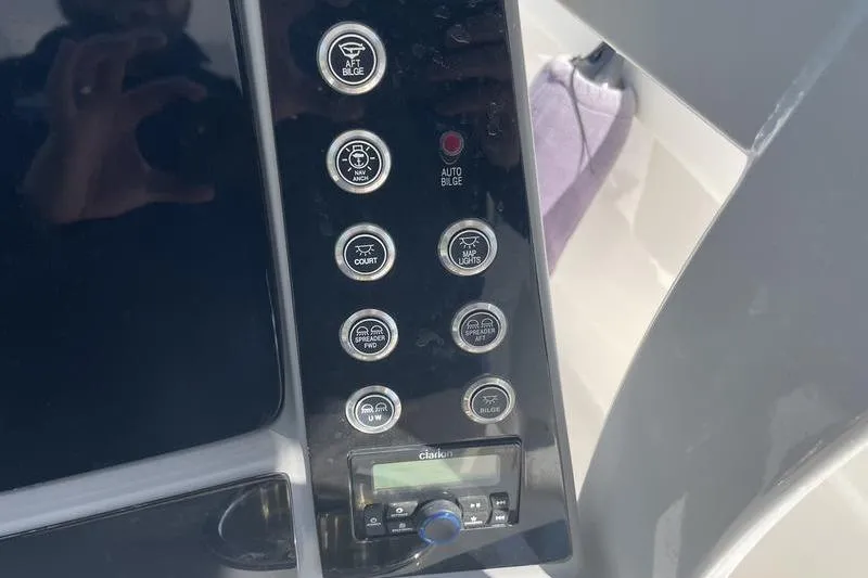 Slide: The Image of Control panel of 2023 Robalo R270 Center Console boat with various function buttons. - 19