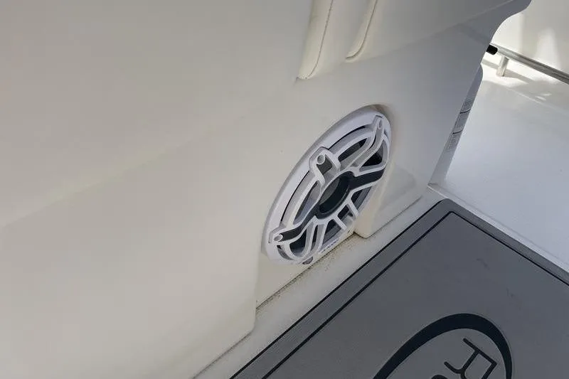 Slide: The Image of 2023 Robalo R270 Center Console boat interior with speaker detail. - 21