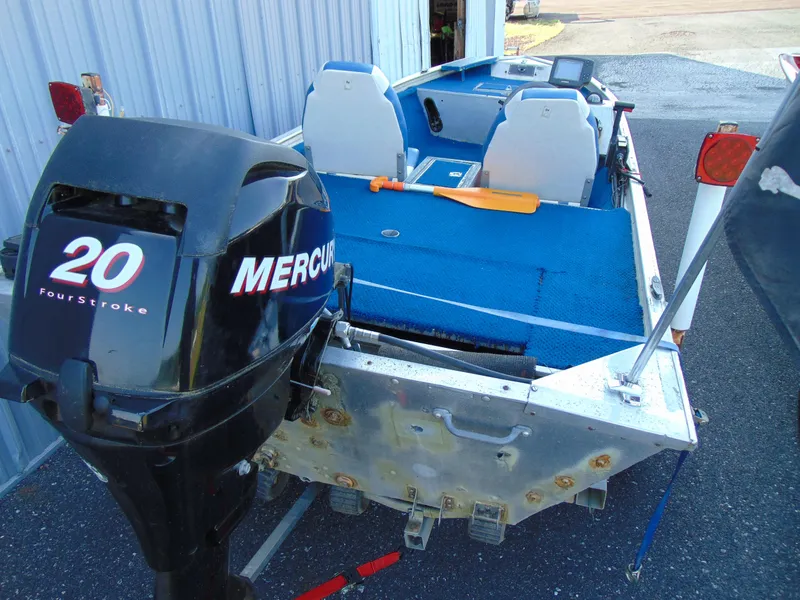 Slide: The Image of 1985 Fisher Hawk 3V boat with Mercury 20 HP outboard motor. - 3