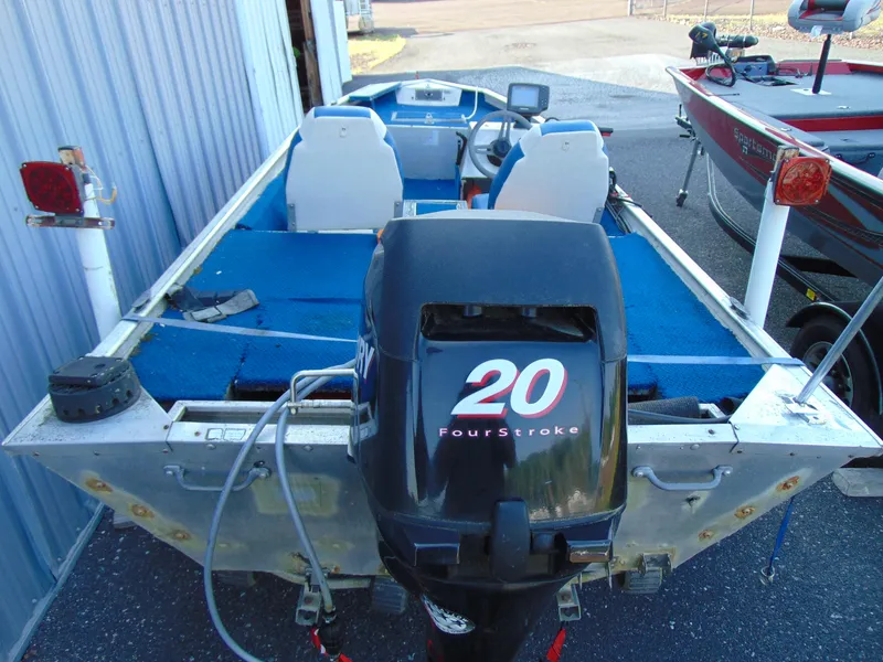 Slide: The Image of 1985 Fisher Hawk 3V boat with 20 HP outboard motor. - 4